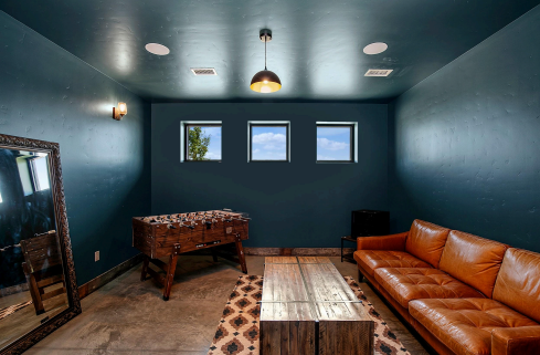 Boise wedding planners appreciate Rustic Daisy’s groom suite, featuring a leather couch, foosball table, and natural lighting.